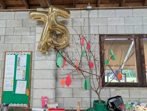 picture of giving tree at Quaker Knoll's 75th celebration